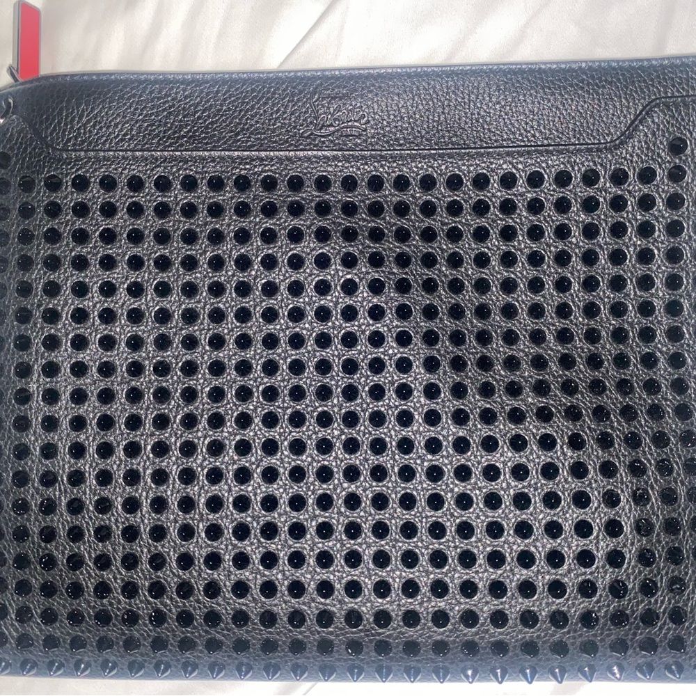 Brand new and never used Christian Louboutin pouch/crossbody. New leather smell!